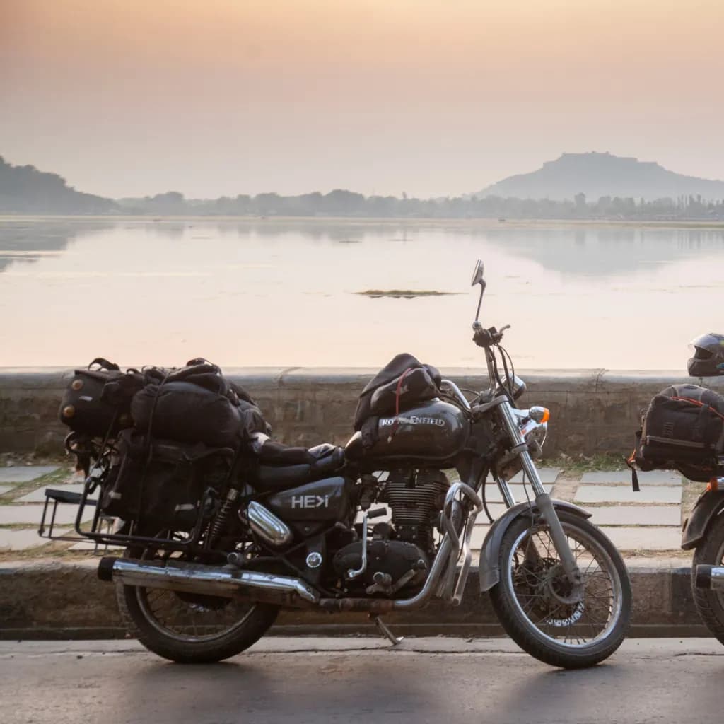 Motorbike parked by a lake on a Tentasy expedition